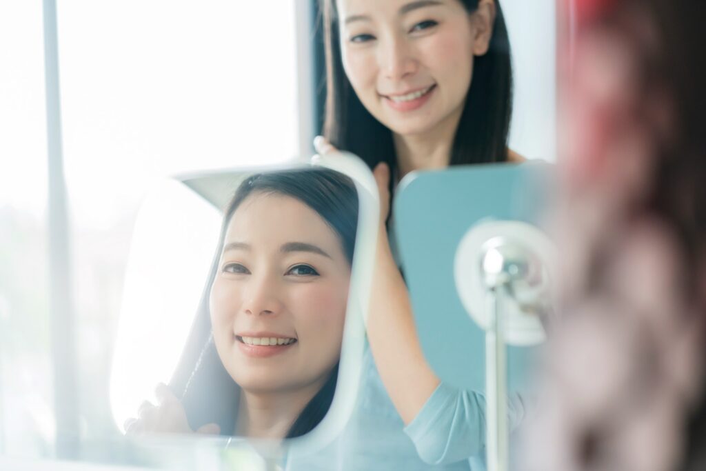 beautiful-asian-woman-makeup-hair-set-wirh-mirror-bathroom-with-morning-light