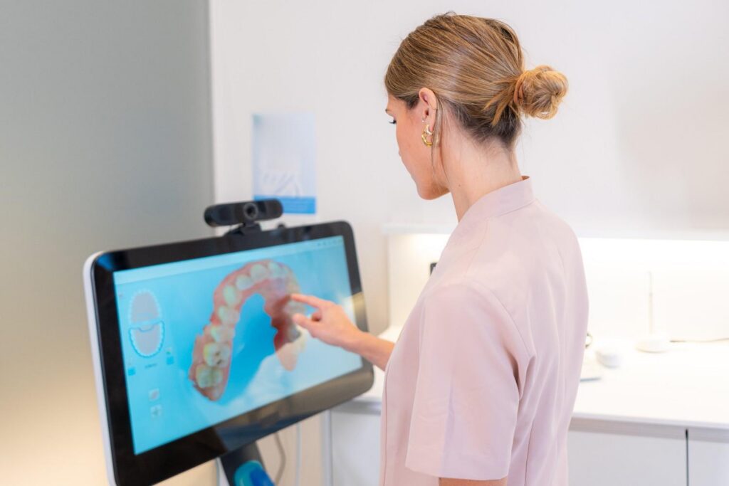 Woman reviewing a digital 3D dental scan