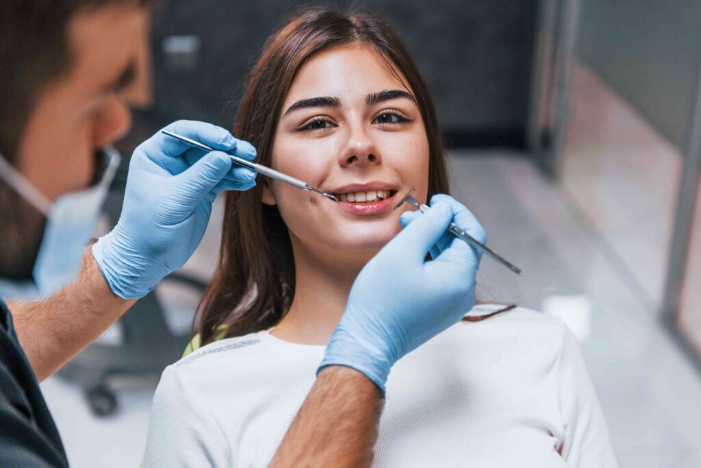 Smiling patient during a routine dental examination.